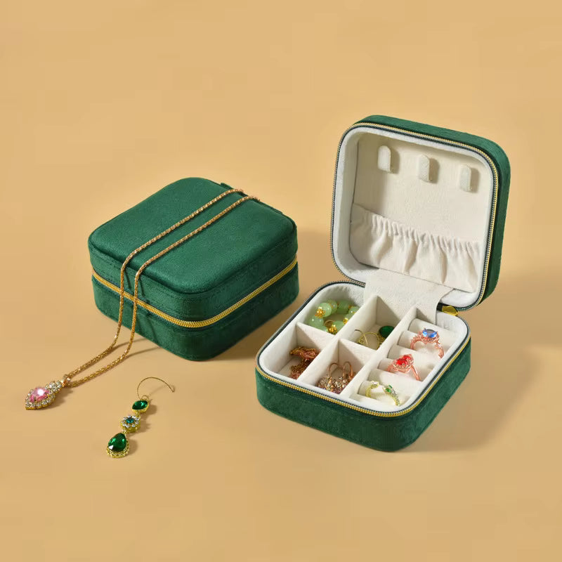 Green jewelry box with a velvet finish inside and a premium look