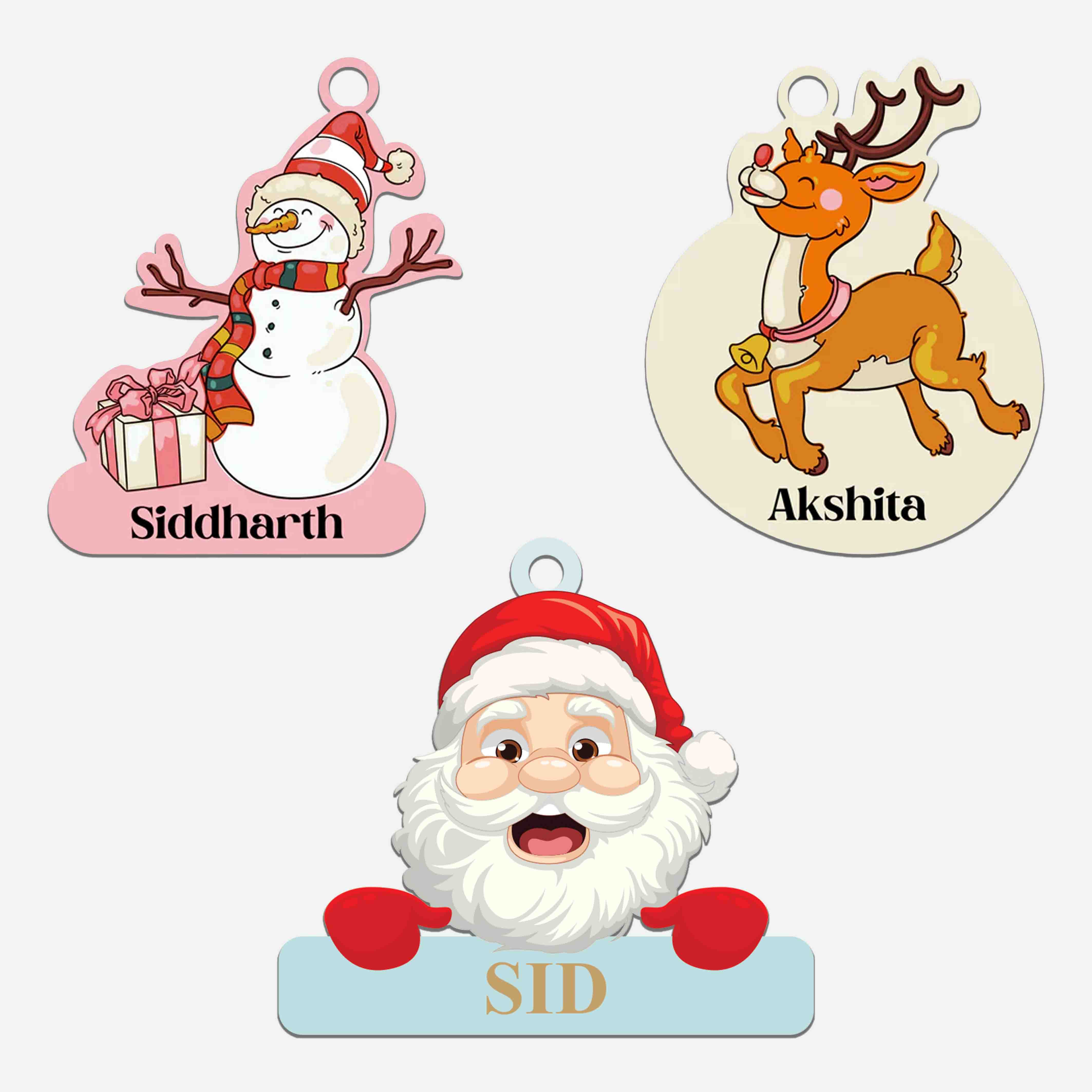 Three Christmas-themed ornaments with personalized names on a white background